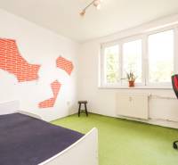 Details of the children's room in a 3-room apartment with colorful decorations on the walls.