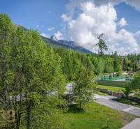 The view from the Recreational Apartment in the High Tatras includes greenery and mountain scenery.