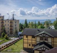 Buildings in the beautiful surroundings of the High Tatras, a recreational apartment surrounded by greenery and mountains.