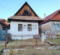 A family house in Ladzany with traditional architecture, a white facade, and a sloped roof.