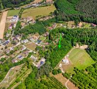 Aerial view of recreational plots surrounded by forests and houses in Púchov, Vieska-Bezdedov.