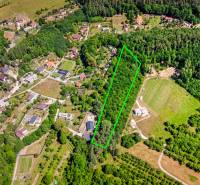 Aerial view of recreational plots in Púchov on Vieska-Bezdedov street, surrounded by greenery.
