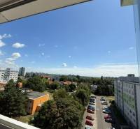 View of the parking lot and surroundings from a 2-room apartment on Bučinová Street, Bratislava - Vrakuňa.