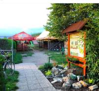 Gastro premises with seating, garden, and information board in Devínska Nová Ves, Devínske jazero.