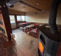 Cozy interior restaurant with a fireplace and wooden furniture, gastro spaces.