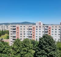 A view of apartment buildings in Nitra on Petzwalova Street, with a view of the surrounding nature.