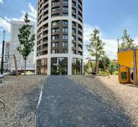 Modern apartment building in Bratislava - Old Town, on Čulenova Street, with an adjacent children's playground.