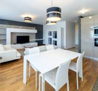 Living room with kitchen in a 3-room apartment, bright walls and modern appliances.