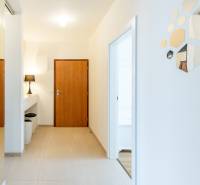 Interior of a 3-room apartment with designer mirrors and wooden doors.