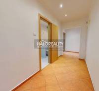 Tiled hallway in a 3-room apartment with white walls and built-in lights.
