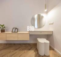 A minimalist interior with white furniture and decorations in a 3-room apartment on Benediktiho Street.