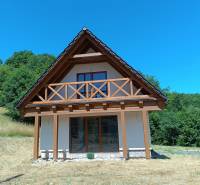 A cottage in Horné Hámre surrounded by nature and forests with a beautiful wooden terrace.