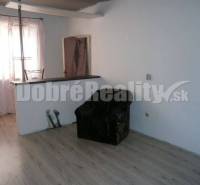 Interior of a family house with an armchair and a counter, laminate flooring, furnishings.