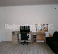 Interior of a family house with a table, chair, and sofa, bright space.