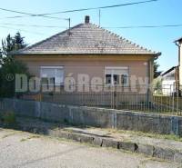 A family house in Rúbaň with a simple facade, a sloped roof, and a front garden.