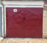 Red garage door on Michalovská Street, Košice - Západ district.