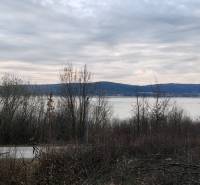 Recreational plots on Eva Street in Holčíkovce offer views of the lake and mountains.