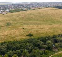 Fields and forest in Košice - Luník IX district, neighboring roads are also visible.