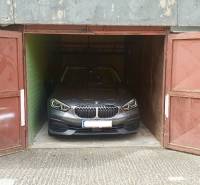 A car parked inside a garage on Dudvážska Street in Bratislava-Podunajské Biskupice.