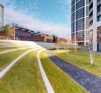 An amphitheater with a lawn, surrounded by modern buildings on Čulenova Street, appears peaceful.
