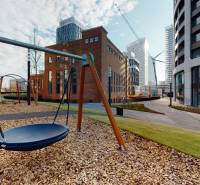 On Čulenova Street, there is a modern playground surrounded by architecture and a 2-room apartment.
