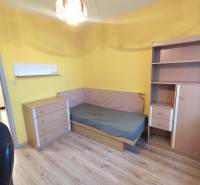 A cozy room with a bed and furniture in a 3-room apartment.