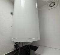 Electric boiler in the bathroom of a one-room apartment showing installation details.
