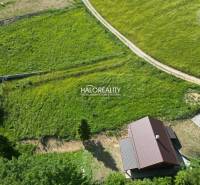 Aerial view of Recreational plots in Vyšné Ružbachy with green meadows and a house.