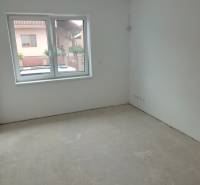 Empty room in a family house with a window on the ground floor.