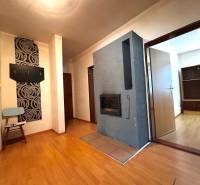 Hallway in a 3-room apartment with wooden flooring and wall hooks.