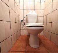 A bathroom in a 3-room apartment with tiles on the walls and floor.