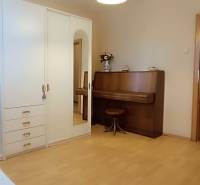 A room in a 3-room apartment with a wardrobe and a dressing table.