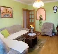 Living room with a sofa, table, and television in a 3-room apartment.