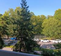 View from the balcony on Zoltán Kodály Street in Galanta, a 3-room apartment near the road and trees.