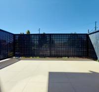A bright terrace with perforated railing in a 2-room apartment, sunny day.