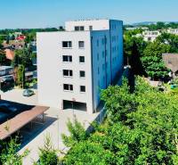 Apartment building on Geologická Street in Bratislava - Podunajské Biskupice surrounded by greenery.