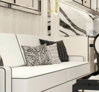 Luxury furnishing of a 2-room apartment with designer cushions and elegant details.