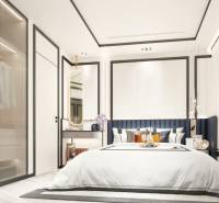 A bedroom in a 2-room apartment with a large bed, a wardrobe, and a mirror.