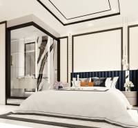 A bedroom in a 3-room apartment with a large bed and a glass-walled bathroom.