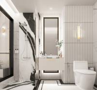 Elegant white bathroom in a 3-room apartment with a shower and a mirror.