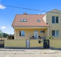A family house on Tehelná Street in Sereď with a red roof and yellow facade.