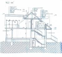 Construction plan section of a family house with an insulation system, structure, and staircases.
