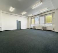 Offices with large windows and a sink, suitable for business.