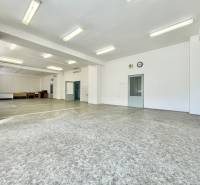 Spacious offices with white walls and lighting, ideal for work purposes.