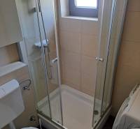 Bathroom with toilet and shower in a 3-room apartment.