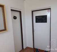 Interior of the building with doors to the toilet and a room for body balance, mirror.