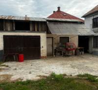 Family house in Bzovík with courtyards, renovation needed, garage and annex.