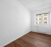 An empty room with white walls and a window in a 3-room apartment.