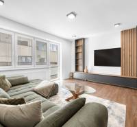 Living room in a 3-room apartment with a comfortable sofa and modern furniture.