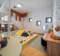 Children's corner with a ball pool and games as part of apartment construction.